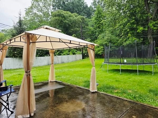 7957 Pamela Dr, North Royalton, OH 44133 - view of yard with a trampoline, a gazebo, and a patio