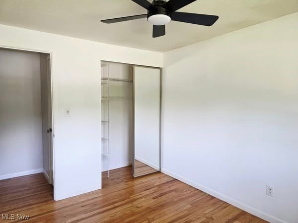 7957 Pamela Dr, North Royalton, OH 44133 - unfurnished bedroom featuring a closet, wood finished floors, and ceiling fan