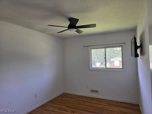 7957 Pamela Dr, North Royalton, OH 44133 - empty room with wood finished floors and ceiling fan