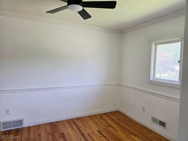 7957 Pamela Dr, North Royalton, OH 44133 - unfurnished room with ornamental molding, a ceiling fan, and wood finished floors