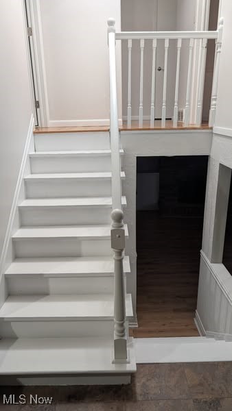 7957 Pamela Dr, North Royalton, OH 44133 - stairway featuring wood finished floors