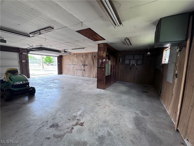 1605 Gihon Rd, Parkersburg, WV 26101 - garage with wood walls, electric panel, and a garage door opener