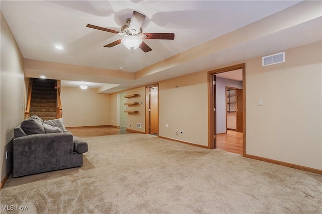 1549 Galaxy Dr, Mogadore, OH 44260 - living area with light colored carpet, stairway, ceiling fan, and recessed lighting