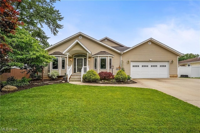 1549 Galaxy Dr, Mogadore, OH 44260 - view of front of house featuring an attached garage and concrete driveway