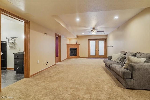 1549 Galaxy Dr, Mogadore, OH 44260 - living area featuring ceiling fan, carpet floors, a glass covered fireplace, recessed lighting, and french doors
