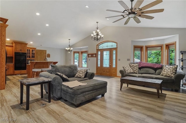 1549 Galaxy Dr, Mogadore, OH 44260 - living area featuring a chandelier, light wood finished floors, recessed lighting, a ceiling fan, and high vaulted ceiling