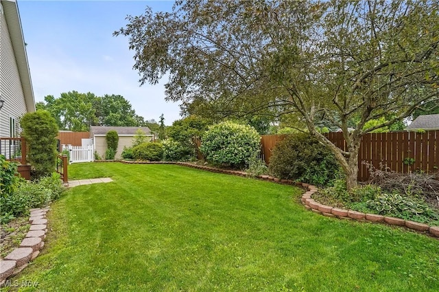 1549 Galaxy Dr, Mogadore, OH 44260 - fenced backyard featuring an outbuilding