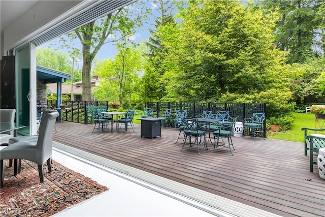 12866 Lake Shore Blvd, Bratenahl, OH 44108 - deck featuring outdoor dining area and view of scattered trees