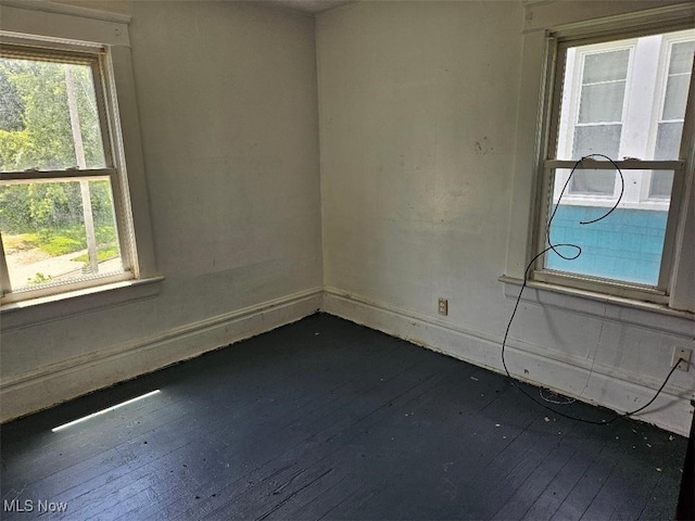 798 Stadelman Ave, Akron, OH 44320 - unfurnished room featuring dark wood-type flooring and healthy amount of natural light
