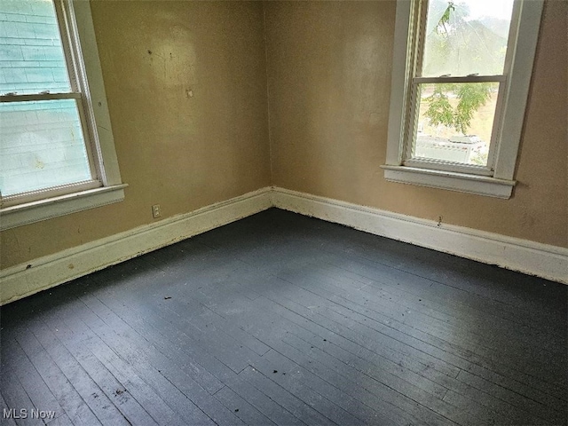 798 Stadelman Ave, Akron, OH 44320 - spare room featuring dark wood-style floors and baseboards