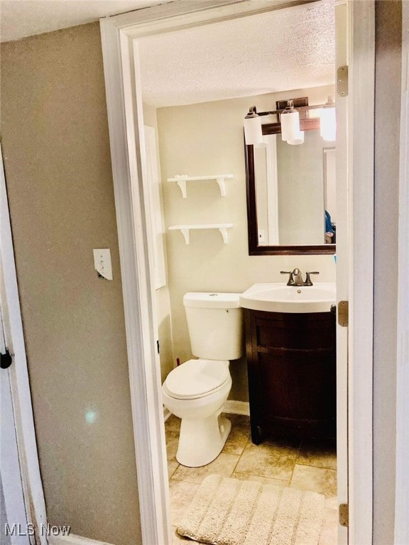 28842 Oring Rd, North Olmsted, OH 44070 - bathroom featuring vanity, tile patterned flooring, and a textured ceiling