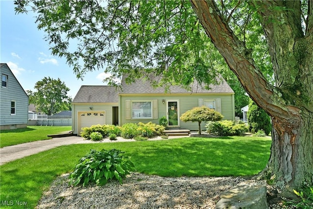 437 Hazel St, Girard, OH 44420 - cape cod house with concrete driveway and a garage