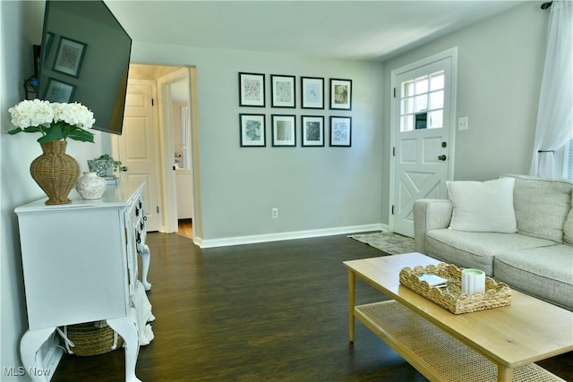 437 Hazel St, Girard, OH 44420 - living area featuring baseboards and dark wood finished floors