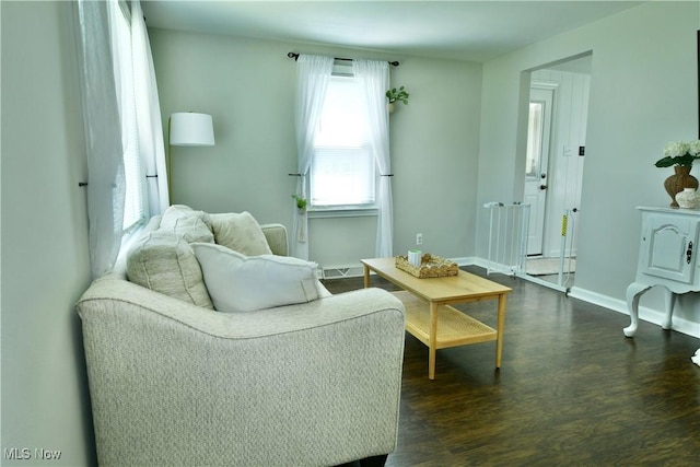 437 Hazel St, Girard, OH 44420 - living area with dark wood-style flooring and baseboards