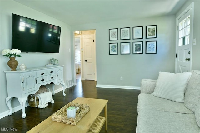 437 Hazel St, Girard, OH 44420 - living area featuring dark wood finished floors and healthy amount of natural light