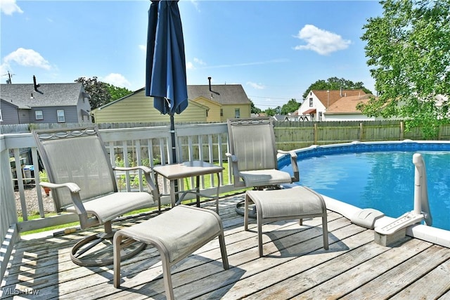 437 Hazel St, Girard, OH 44420 - view of swimming pool featuring a wooden deck and a fenced backyard