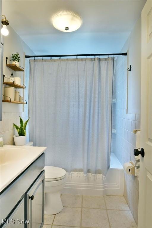437 Hazel St, Girard, OH 44420 - bathroom featuring tile patterned floors, vanity, shower / tub combo, and tasteful backsplash
