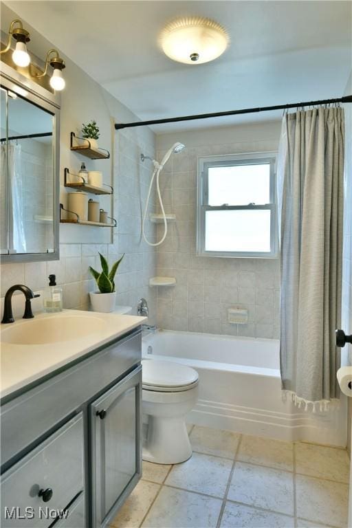 437 Hazel St, Girard, OH 44420 - full bathroom featuring vanity, shower / bath combo with shower curtain, and tile patterned floors