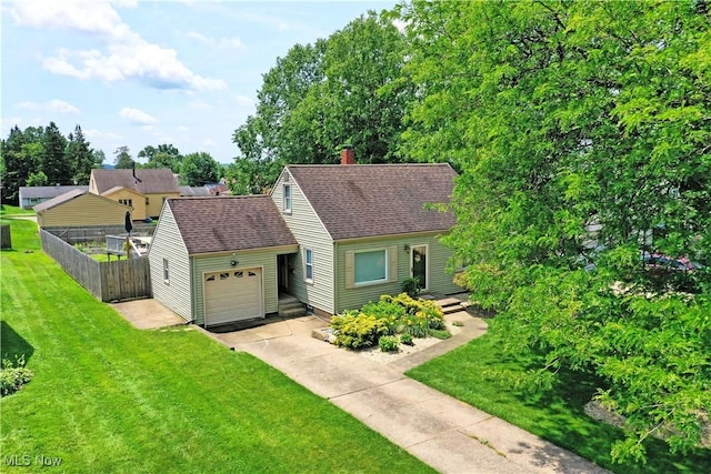 437 Hazel St, Girard, OH 44420 - view of front of home featuring driveway, roof with shingles, an attached garage, and a chimney