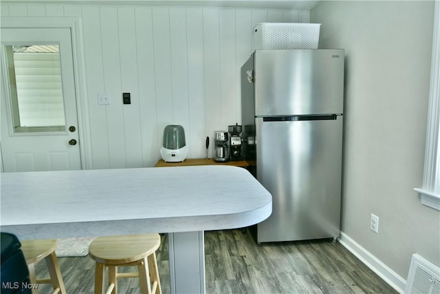 437 Hazel St, Girard, OH 44420 - kitchen featuring freestanding refrigerator and wood finished floors