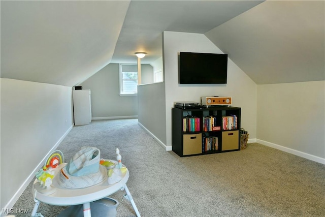 437 Hazel St, Girard, OH 44420 - recreation room with carpet floors and lofted ceiling