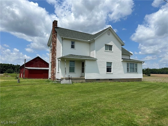 14260 Canaan Center Rd, Creston, OH 44217 - back of property featuring a chimney, a yard, a barn, and a shingled roof