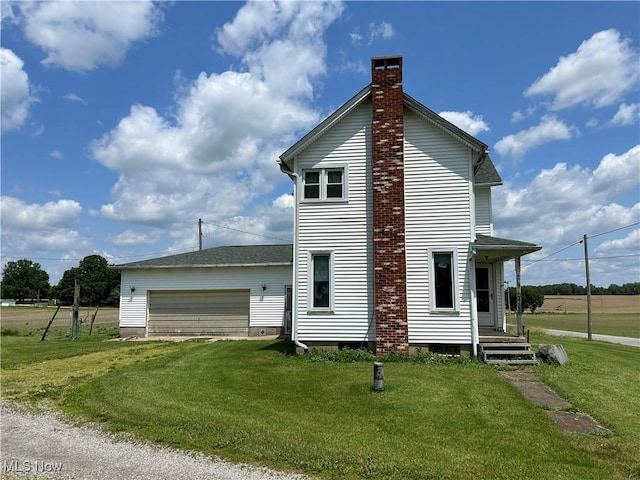 14260 Canaan Center Rd, Creston, OH 44217 - view of property exterior featuring a yard, a chimney, an attached garage, and driveway