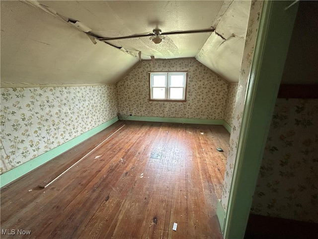 14260 Canaan Center Rd, Creston, OH 44217 - bonus room with hardwood / wood-style floors, vaulted ceiling, and wallpapered walls