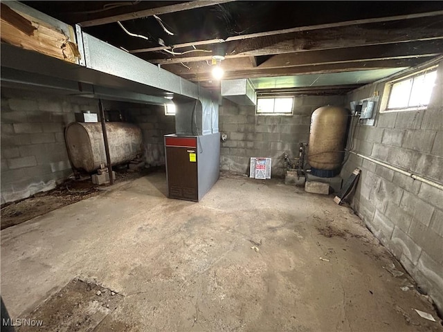 14260 Canaan Center Rd, Creston, OH 44217 - basement with oil tank, heating unit, and a water pressure tank