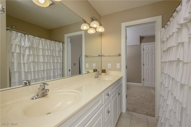 3595 Vineyard Ave NW, Canton, OH 44708 - bathroom featuring double vanity and tile patterned flooring