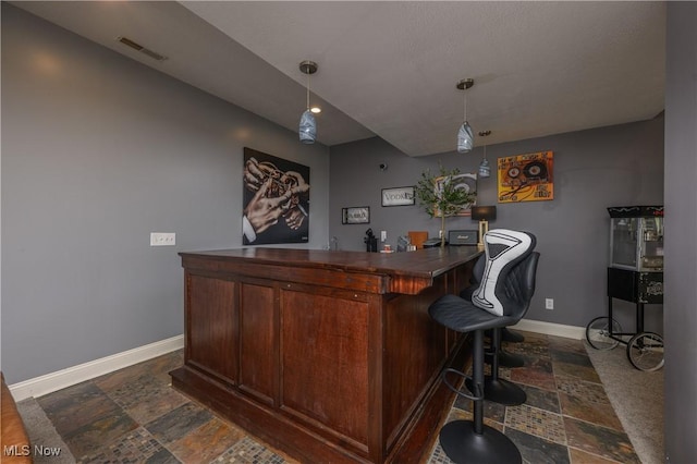 3595 Vineyard Ave NW, Canton, OH 44708 - indoor dry bar with stone tile floors and decorative light fixtures
