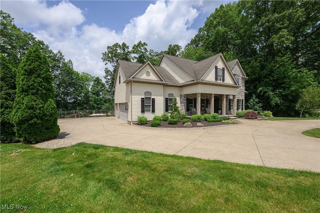 3595 Vineyard Ave NW, Canton, OH 44708 - view of front facade with driveway and stone siding