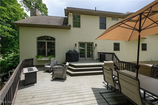 3595 Vineyard Ave NW, Canton, OH 44708 - wooden deck featuring french doors and a grill
