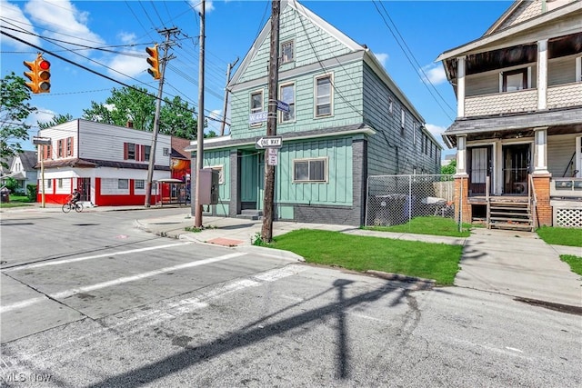 3356 W 44th St, Cleveland, OH 44109 - view of front of property with a porch and board and batten siding