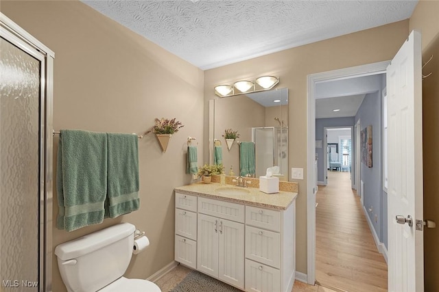4613 Compass Rose Unit 11, Vermilion, OH 44089 - full bath featuring vanity, a stall shower, and a textured ceiling
