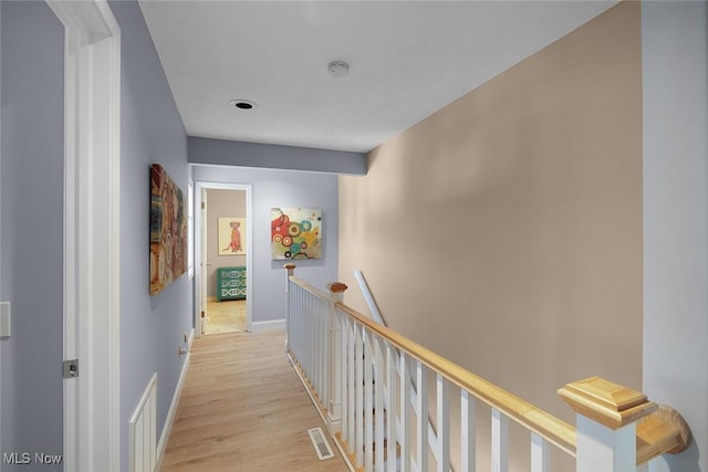 4613 Compass Rose Unit 11, Vermilion, OH 44089 - hallway with an upstairs landing and light wood finished floors