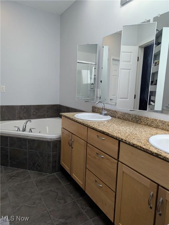 1949 Columbus Rd, Cleveland, OH 44113 - bathroom featuring double vanity and a bath