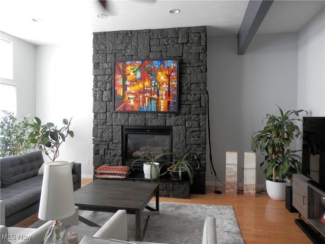 1949 Columbus Rd, Cleveland, OH 44113 - living area featuring wood finished floors and a stone fireplace