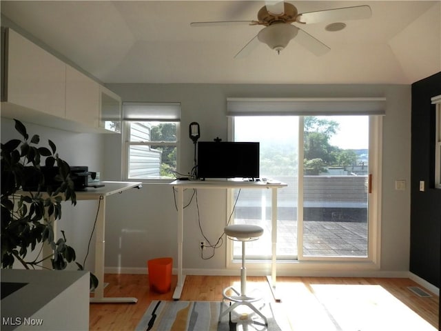 1949 Columbus Rd, Cleveland, OH 44113 - kitchen featuring light wood finished floors, white cabinetry, a ceiling fan, and vaulted ceiling