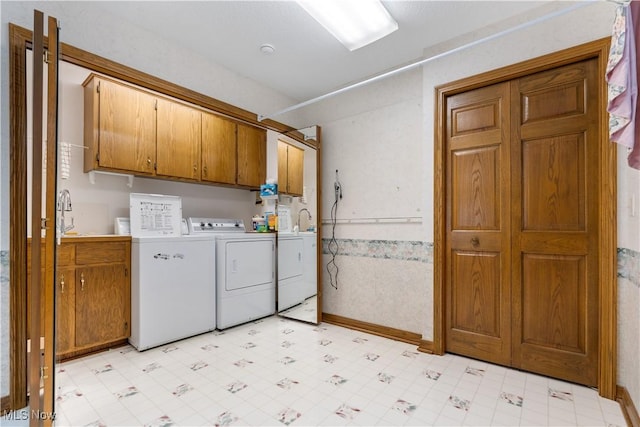221 Winston Ave NE, North Canton, OH 44720 - washroom with cabinet space, independent washer and dryer, and light flooring
