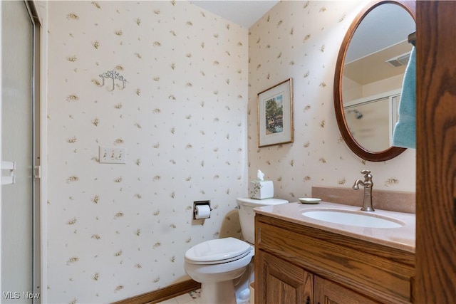 221 Winston Ave NE, North Canton, OH 44720 - bathroom with wallpapered walls, vanity, and a shower with shower door
