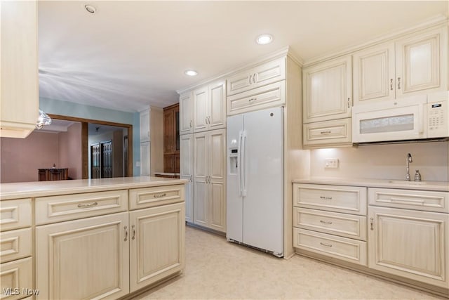 221 Winston Ave NE, North Canton, OH 44720 - kitchen with white appliances, light countertops, cream cabinets, and recessed lighting
