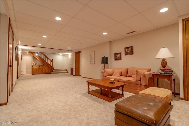 221 Winston Ave NE, North Canton, OH 44720 - living room with light colored carpet, stairway, recessed lighting, and a drop ceiling