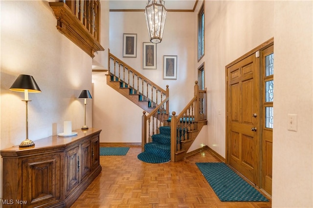 221 Winston Ave NE, North Canton, OH 44720 - entryway with stairway, a high ceiling, and a chandelier