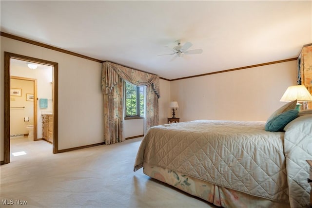 221 Winston Ave NE, North Canton, OH 44720 - bedroom with ornamental molding, light colored carpet, ensuite bathroom, and a ceiling fan