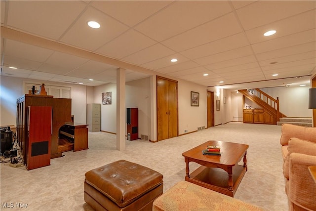 221 Winston Ave NE, North Canton, OH 44720 - living area with carpet, stairs, a paneled ceiling, and recessed lighting