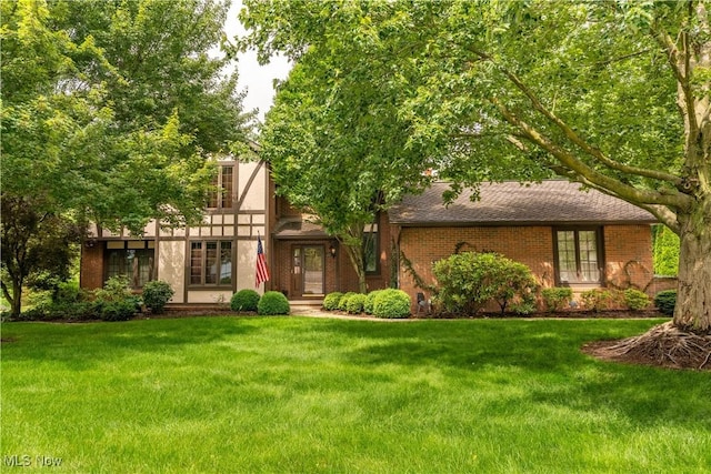 221 Winston Ave NE, North Canton, OH 44720 - view of front of property with a front lawn and brick siding