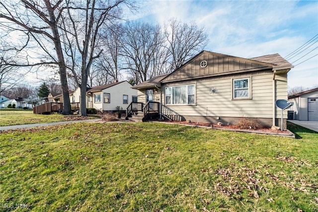3214 Quentin Dr, Youngstown, OH 44511 - back of house featuring a yard and board and batten siding
