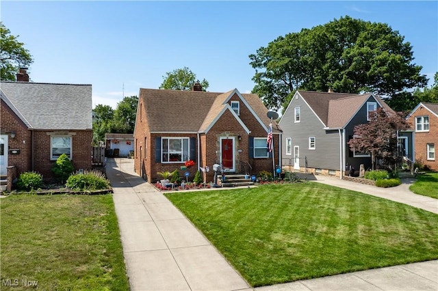 4707 Grantwood Dr, Parma, OH 44134 - bungalow featuring brick siding, a front lawn, and a chimney