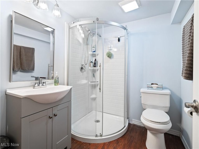 4707 Grantwood Dr, Parma, OH 44134 - bathroom with wood finished floors, a shower stall, and vanity